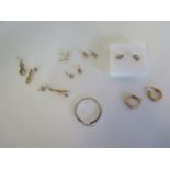 Seven pairs of 9ct gold earrings and two single, approx 5 grams