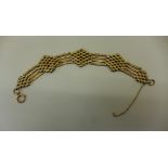 A 9ct yellow gold gate link bracelet, 22cm long, approx 19 grams, some wear consistent with age,