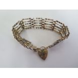 A hallmarked 9ct gold gate link bracelet, approx 10.9 grams, generally good, some usage wear