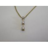 An 18ct yellow gold three stone diamond pendant, approx 0.25ct - on an 18ct chain, as new, approx