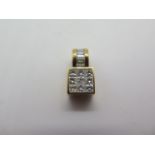 An 18ct yellow gold diamond set pendant, 17mm x 8mm x 6mm - in good condition, diamonds bright,