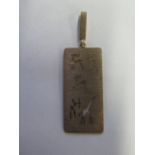 A 9ct gold South African pendant, rectangular in shape with pierced design depicting big game