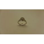 A 9ct white gold cluster diamond ring size L. Approx. 3.1 grams. Diamonds apporx 0.29ct marked 9k