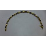 A 14k yellow gold sapphire bracelet 19cm long approx 10.7 grams - in good condition marked 14k