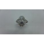 An 18ct white gold diamond double cluster ring, the two centre stones approx 0.2ct each - hallmarked