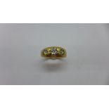 An 18ct yellow gold three stone diamond ring size Q/R - approx weight 6.4 grams - marked 18ct -