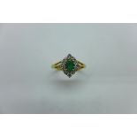 An 18ct hallmarked yellow gold emerald and diamond, weight approx 3.2 grams, as new - Size M