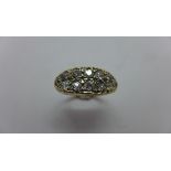 A yellow gold 12 stone diamond ring, largest diamonds approx 0.10ct, tests to approx 18ct, approx