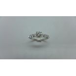 An 18ct white gold 9 stone diamond ring - 1ct of diamonds in total - diamond weight marked to inside