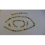A 18ct yellow gold multi-gem set necklace, earring and bracelet set with necklace extension.
