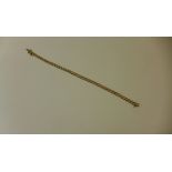 A hallmarked 9ct yellow gold diamond tennis bracelet 19cm long - approx weight 8 grams - in