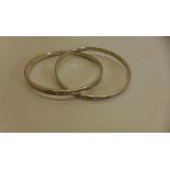 A Tiffany & Co 1887 entwined interlocking silver double bangle 6.7cm exterior width, approx 39.4