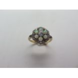 An 18ct yellow gold diamond and opal cluster ring, head approx 12mm diameter, ring size M, approx