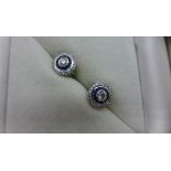 A pair of 18ct white gold sapphire and diamond target earrings marked 18k - 7mm diameter - approx