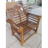 A pair of hardwood garden chairs
