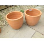 A pair of terracotta planters - retail at £9.99 each