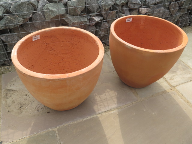 A pair of terracotta plant pots 43cm high - retail at £39.95 each