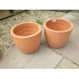 A pair of terracotta planters - retail at £9.99 each