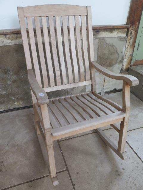 A teak garden rocking chair