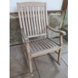 A teak garden rocking chair