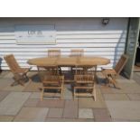 A new boxed teak garden table & 6 folding chairs. Table size extends from 180cm to 240cm with a 90cm