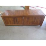 A hardwood garden cushion box 150cm wide, 50cm high, 52cm deep