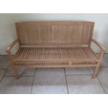 A good quality teak bench boxed 150cm wide