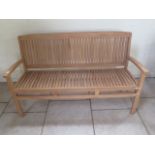 A good quality teak bench boxed 150cm wide