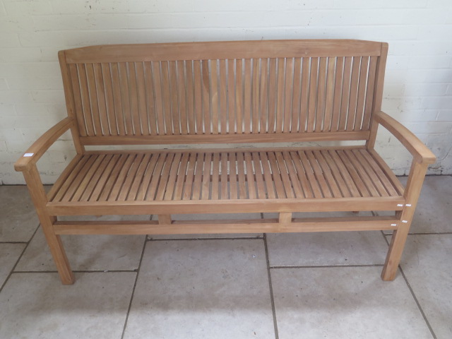 A good quality teak bench boxed 150cm wide