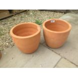 A pair of terracotta planters - retail at £9.99 each