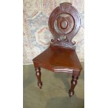 A Victorian mahogany hall chair. In restored condition