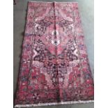 A hand knotted Hamadan rug. Size 2.26m x 1.2m