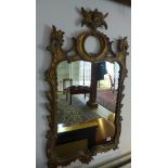 An ornate gilt mirror 105cm x 57cm
