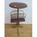A mahogany and brass table top magazine rack, 79cm tall, 35cm diameter in good condition.