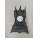 A bronze monument mantle clock, 21cm tall, movement appears overwound otherwise good condition