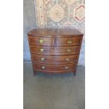 A 19th century inlaid mahogany five drawer bowfronted chest on splayed bracket feet. 106 cm tall x