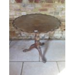 A mahogany tilt top side table with a birdcage action on a carved tripod base. 70 cm tall x 70 cm