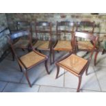 A set of 6 simulated brass inlaid sabre leg dining chairs with cane seats, some old repairs and