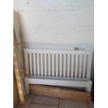 A 5 foot cream double bed with slatted headboard