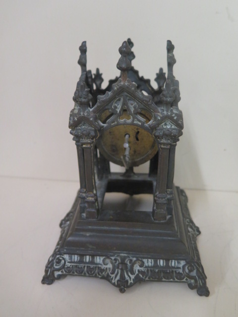 A bronze monument mantle clock, 21cm tall, movement appears overwound otherwise good condition - Image 3 of 3