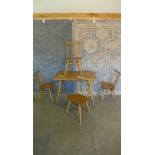 An Ercol Elm table and 4 chairs. Table 73cm tall 99 x 68cm, chairs 80cm tall, all solid, all have