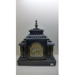 A wooden ebonised German 14 day striking mantle clock, running, no key, 52cm tall, 43cm wide