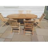A new boxed teak garden table & 6 folding chairs. Table size extends from 150cm to 200cm with single