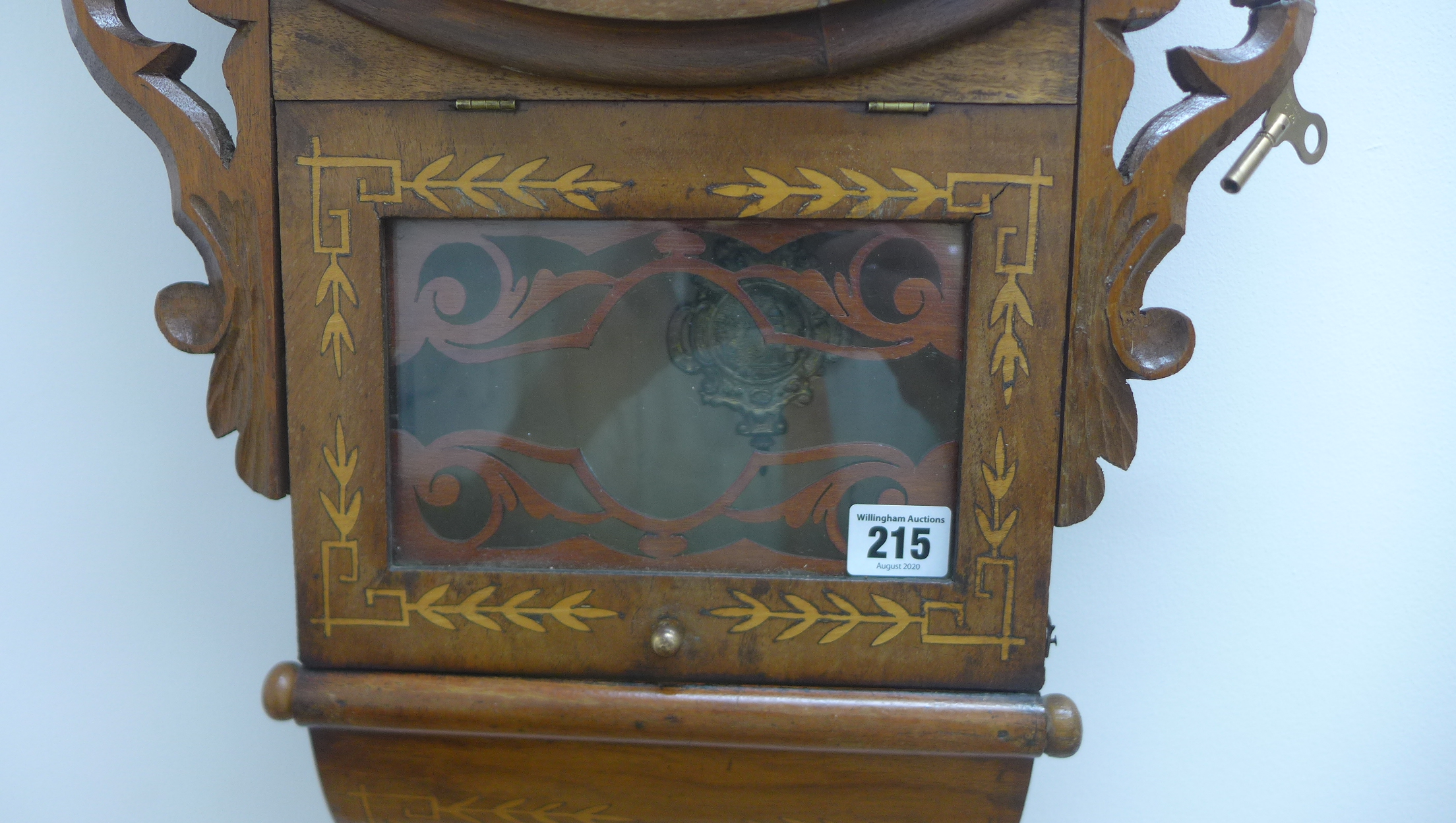 An 8 day American wallclock drop case with inlay of flowers and animals, running in saleroom, 74cm - Image 2 of 3