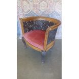 An unusual 19th century oak tub shaped chair with ornate foliate carving on shaped legs with a