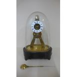 A small French skeleton clock by R Holt et che Paris under a glass dome, 25cm tall, dome cracked,