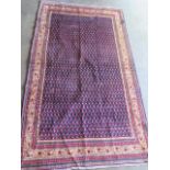 A hand knotted Araak woollen rug. Size 2.17m x 1.3m