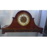 An Edwardian mahogany mantle clock with exposed escapement, 29cm tall, 54cm wide, running but stops,
