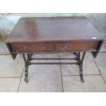 A Georgian style mahogany drop leaf sofa table. 73cm tall x 137cm extended x 56 cm. Removed from a