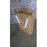 An artist's portable sketching/ painting easel.